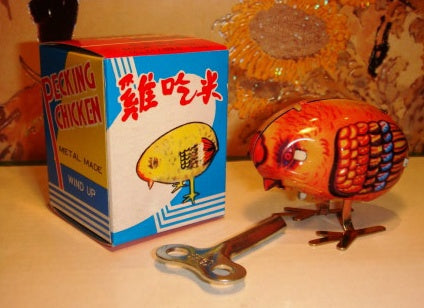 Nostalgic Fun: Children's Wind-up Tin Metal Leap Frog Toy and Collectibles ($\mathbf{7-14}$ Years).