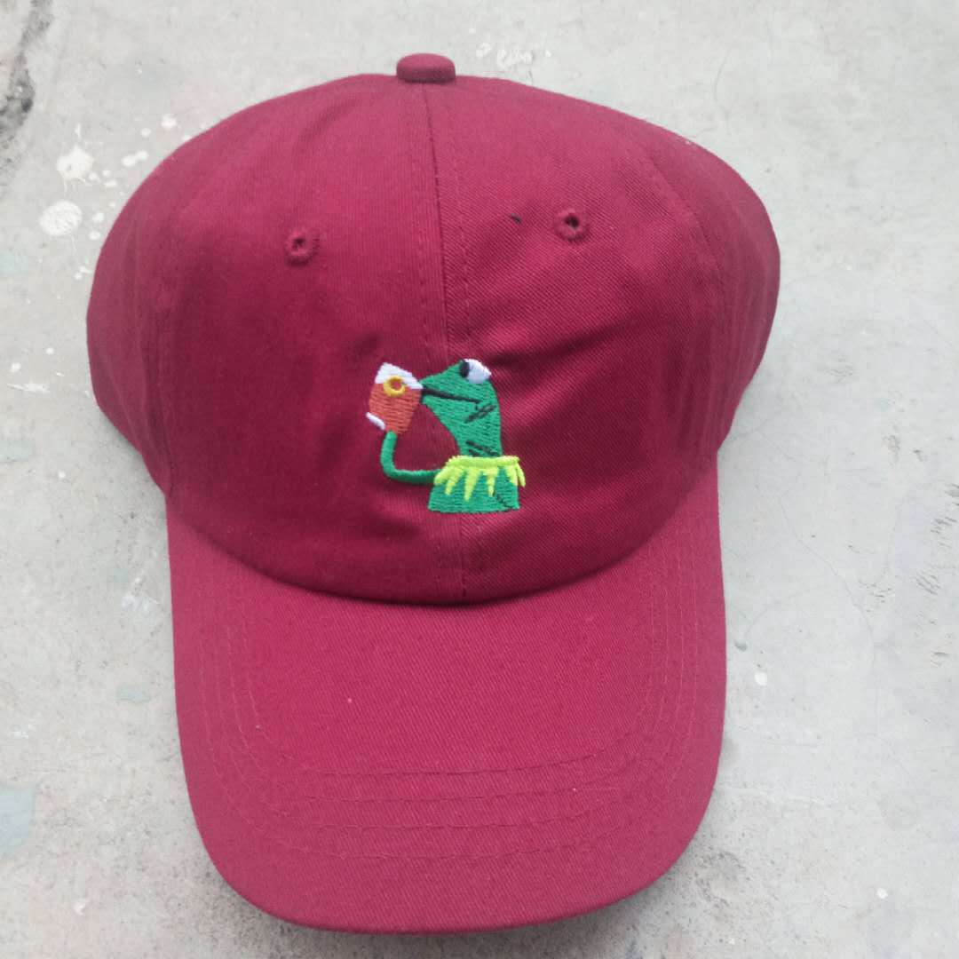 All-Season Style: Adjustable Cartoon Frog Embroidered Baseball Hat with Curved Brim.