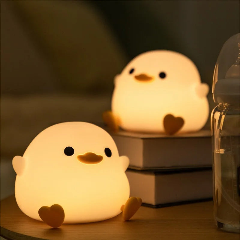 Squishy Sleep Companion: Doudou Duck Silicone Night Lamp with $\mathbf{20}$-Minute Timer & USB Charging.