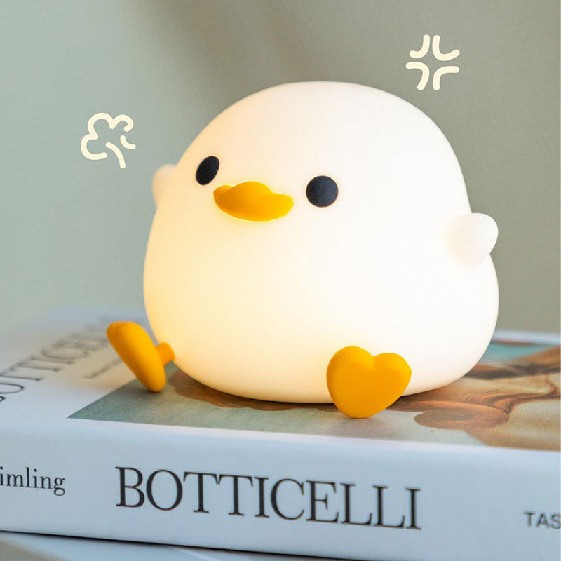 Squishy Sleep Companion: Doudou Duck Silicone Night Lamp with $\mathbf{20}$-Minute Timer & USB Charging.