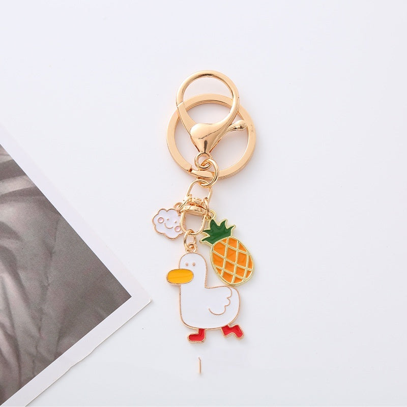Quirky Charm: Pineapple Fried Egg Duck Metal Car Key Ring ($\mathbf{5.9\text{g}}$).