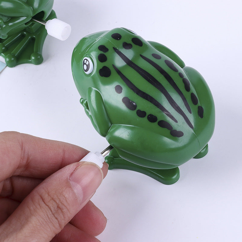 Leap Into Learning: Plastic Frog Jumping Clockwork Educational Toy ($\mathbf{8 \times 5\text{cm}}$).