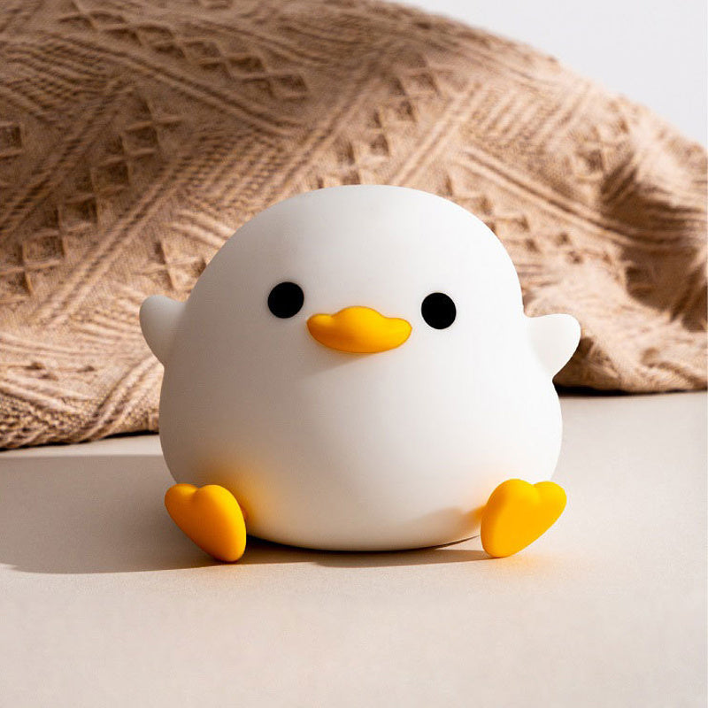 Squishy Sleep Companion: Doudou Duck Silicone Night Lamp with $\mathbf{20}$-Minute Timer & USB Charging.