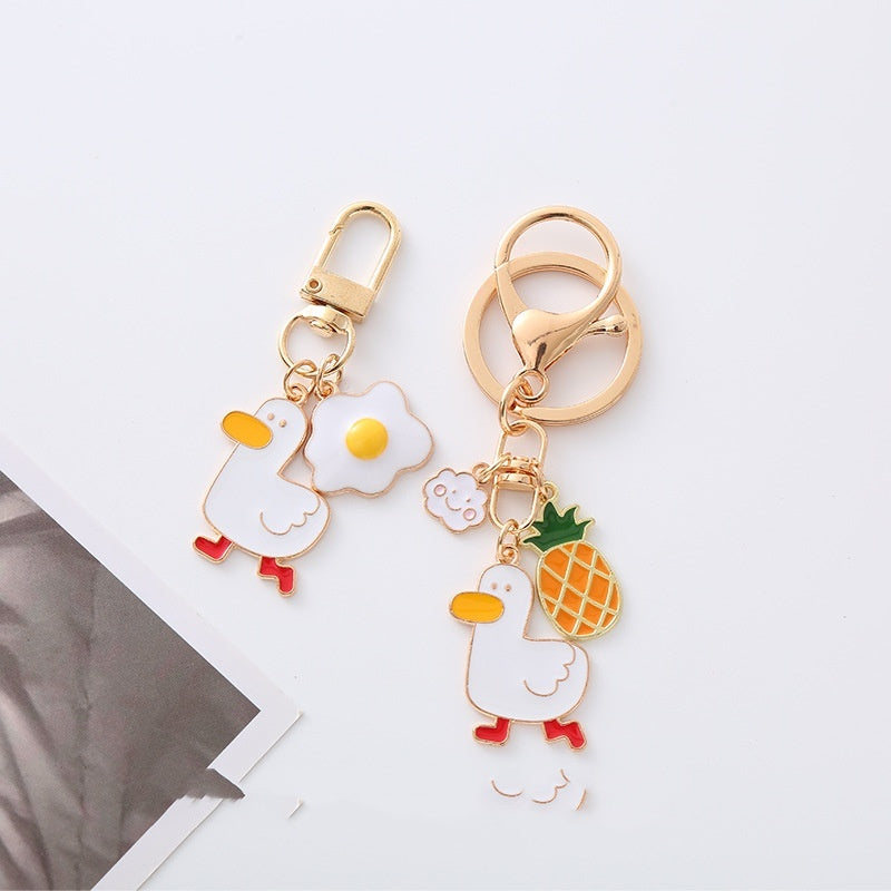 Quirky Charm: Pineapple Fried Egg Duck Metal Car Key Ring ($\mathbf{5.9\text{g}}$).
