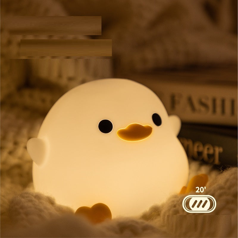 Squishy Sleep Companion: Doudou Duck Silicone Night Lamp with $\mathbf{20}$-Minute Timer & USB Charging.
