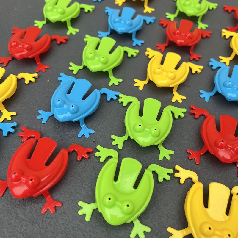 Simple Fun: Children's Classic Pressing Little Jumping Frog Decompression Toy.