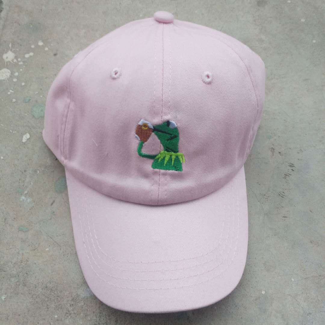 All-Season Style: Adjustable Cartoon Frog Embroidered Baseball Hat with Curved Brim.