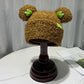 Cozy Fun: Japanese Cartoon Cute Frog Lambswool Bun Head Hat (Warm & Age-Defying).