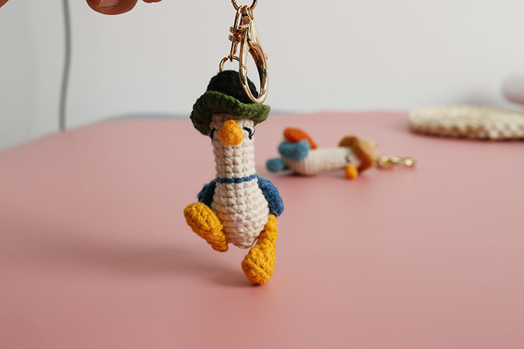 Cozy Companion: Hand-Woven Forward Duck Little Doll Keychain (Wool, Cartoon Style).