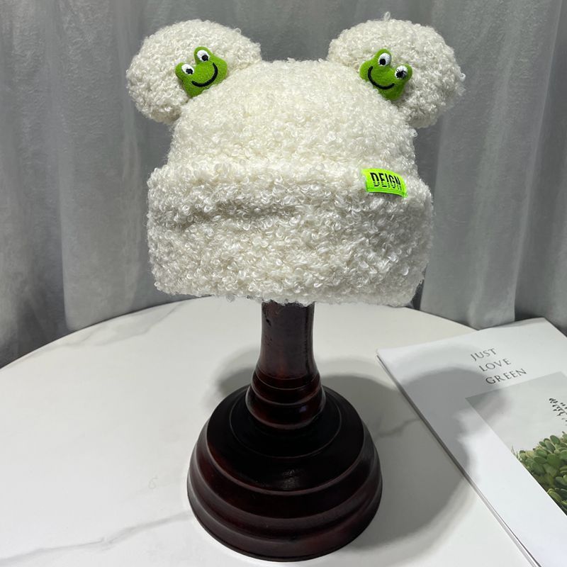 Cozy Fun: Japanese Cartoon Cute Frog Lambswool Bun Head Hat (Warm & Age-Defying).