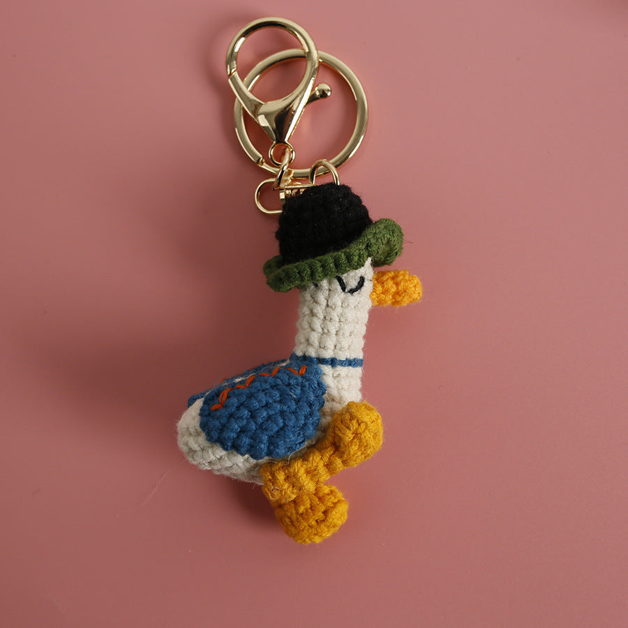 Cozy Companion: Hand-Woven Forward Duck Little Doll Keychain (Wool, Cartoon Style).