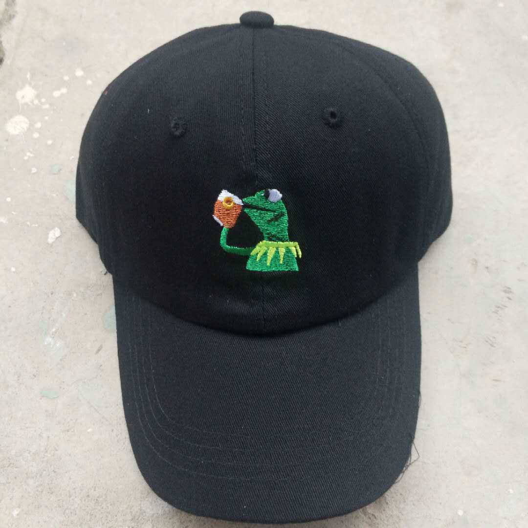 All-Season Style: Adjustable Cartoon Frog Embroidered Baseball Hat with Curved Brim.