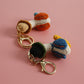 Cozy Companion: Hand-Woven Forward Duck Little Doll Keychain (Wool, Cartoon Style).