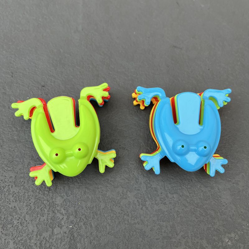 Simple Fun: Children's Classic Pressing Little Jumping Frog Decompression Toy.