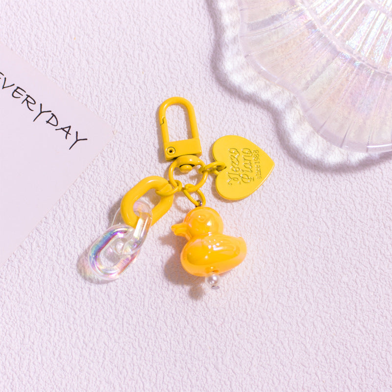 Pocket Charm: Colorful Cartoon Duck Resin Keychain Ornament.