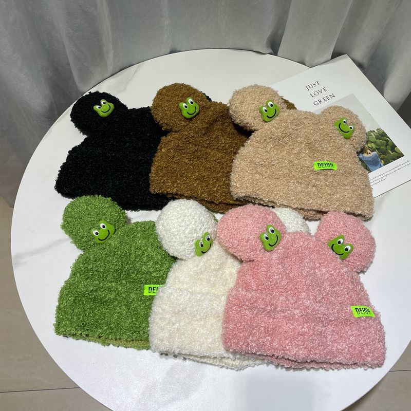 Cozy Fun: Japanese Cartoon Cute Frog Lambswool Bun Head Hat (Warm & Age-Defying).