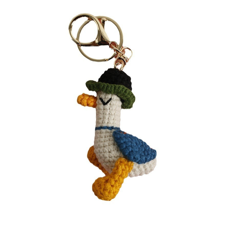 Cozy Companion: Hand-Woven Forward Duck Little Doll Keychain (Wool, Cartoon Style).