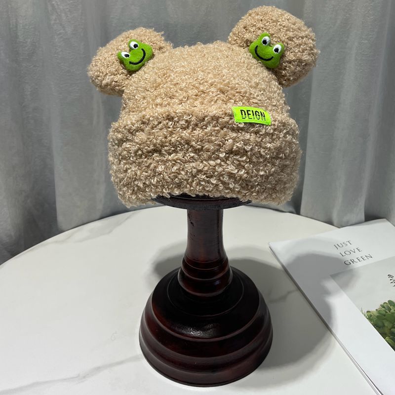 Cozy Fun: Japanese Cartoon Cute Frog Lambswool Bun Head Hat (Warm & Age-Defying).