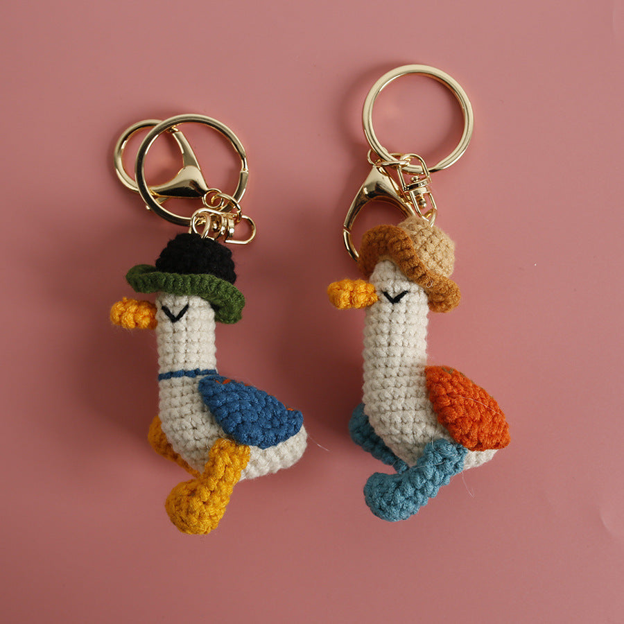 Cozy Companion: Hand-Woven Forward Duck Little Doll Keychain (Wool, Cartoon Style).