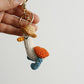 Cozy Companion: Hand-Woven Forward Duck Little Doll Keychain (Wool, Cartoon Style).