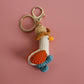 Cozy Companion: Hand-Woven Forward Duck Little Doll Keychain (Wool, Cartoon Style).