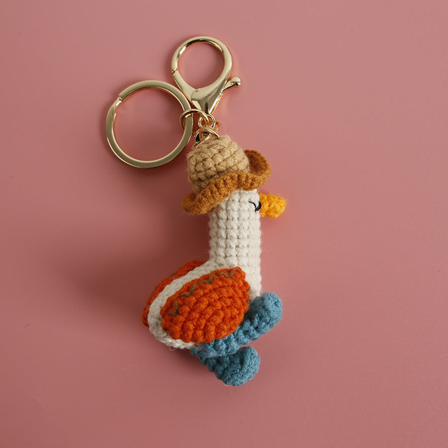 Cozy Companion: Hand-Woven Forward Duck Little Doll Keychain (Wool, Cartoon Style).