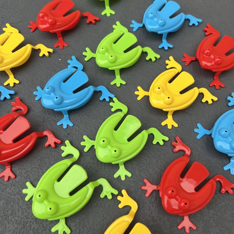 Simple Fun: Children's Classic Pressing Little Jumping Frog Decompression Toy.