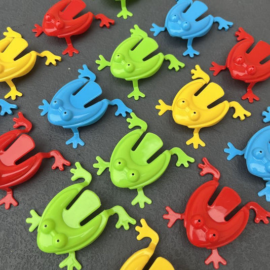 Simple Fun: Children's Classic Pressing Little Jumping Frog Decompression Toy.