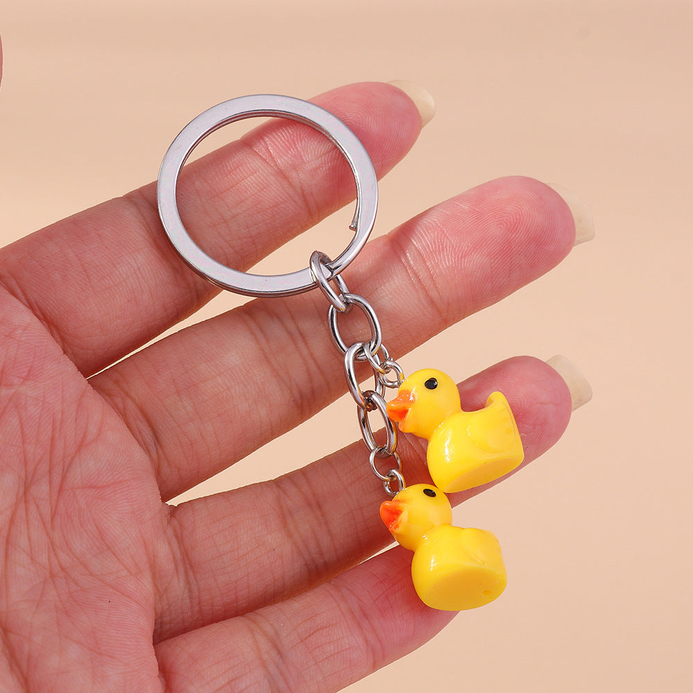 Sky High Style: Cartoon Little Yellow Duck & Cloud Keychain Accessory (Zinc Alloy).